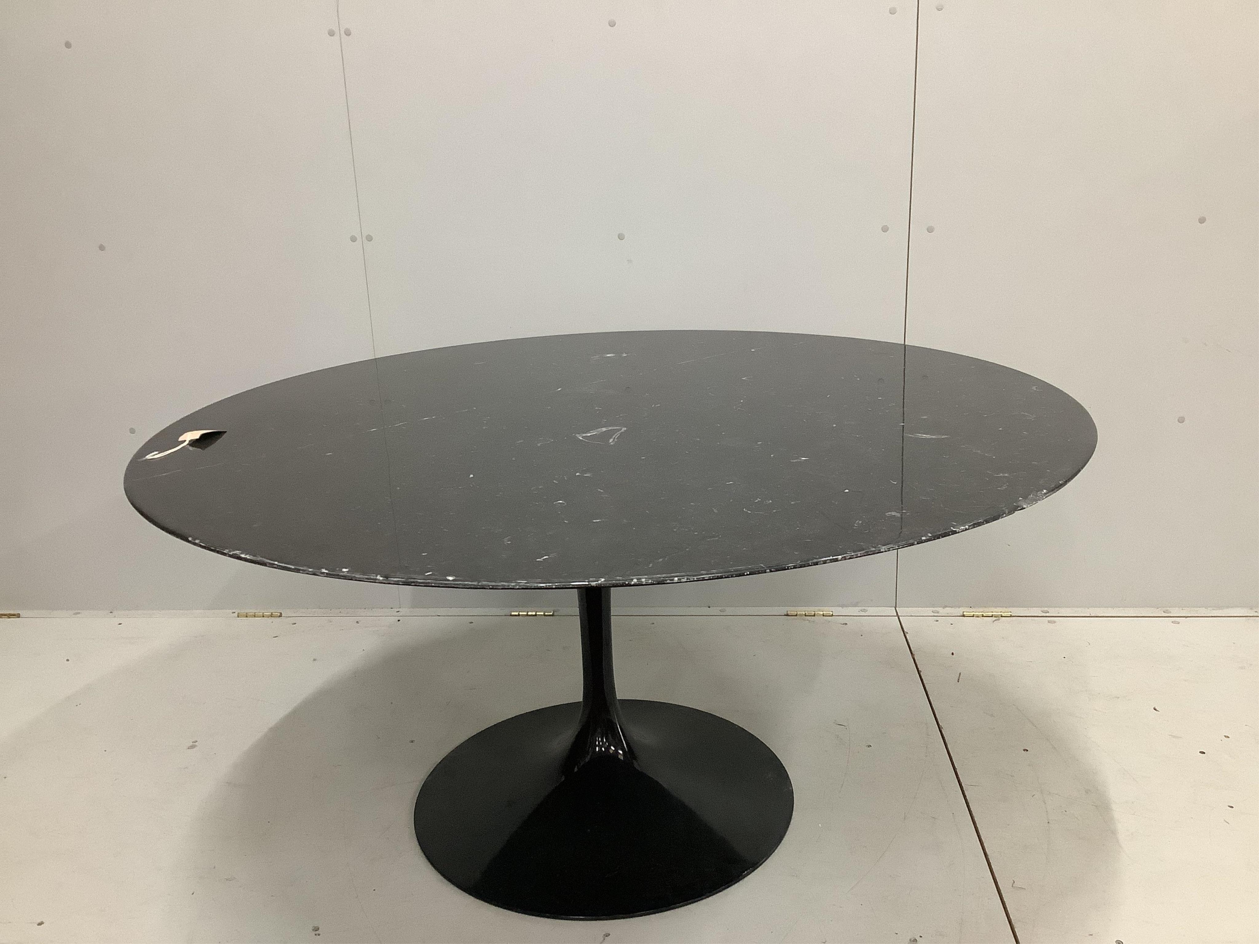 A Knoll Studios Saarinen circular dining table, diameter 136cm, height 72cm. Condition - poor to fair